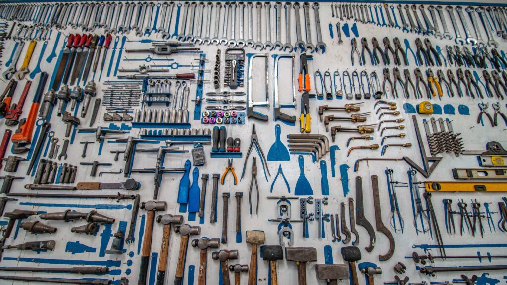 A selection of hand tools arrayed on the floor